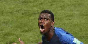 France's Paul Pogba celebrates after scoring his side's third goal .