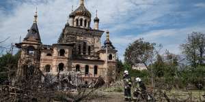 Rescuers take a break after clearing away debris of a heavily damaged building in Vinnytsia last week.