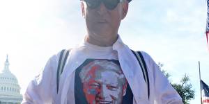 The money shot:Roger Stone reveals the Bill Clinton T-shirt under his suit.