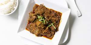 Beef rendang with roasted coconut.