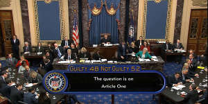 In this image from video,the vote total,52-48 for not guilty,on the first article of impeachment,abuse of power,is displayed on screen during the impeachment trial against President Donald Trump in the Senate.