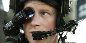 Prince Harry or just plain Captain Wales as he is known in the British Army,wears his monocle gun sight as he sits in the front seat of his cockpit at the British controlled flight-line in Camp Bastion southern Afghanistan.