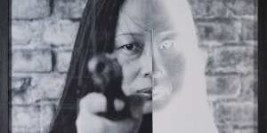 Dialogue (2004),by Xiao Lu,who fired a gun at her own installation.
