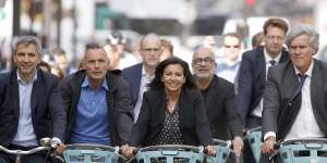 Paris Mayor Anne Hidalgo leads the 15-minute city charge down a bike path on the Rue de Rivoli,part of her plan to have 15 per cent of city trips made by bicycle.