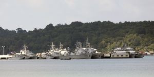 Ships and boats sit moored at the Ream Naval Base near Sihanoukville,Cambodia.