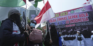 Protesters wave Palestinian flags as they marched in Jakarta last week against Israel’s participation in the Under-20 FIFA World Cup.