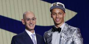 Dyson Daniels is congratulated by NBA commissioner Adam Silver.