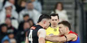 Melbourne’s Jack Viney remonstrates with Collingwood’s Brayden Maynard.