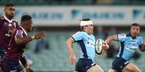 Will Harrison of the Waratahs breaks through the defense during the round six Super Rugby AU match between the Waratahs and the Reds at Sydney Cricket Ground on August 08,2020 in Sydney,Australia.