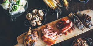 The gathering feast:a platter of meat and sides for four people.