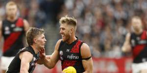 Collingwood rookie Jay Rantall takes on Essendon captain Dyson Heppell on Anzac Day.