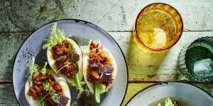 Store-bought bao are stuffed with pork fried with chilli jam and crunchy cucumber.