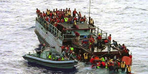 Australian navy personnel rescue asylum-seekers from a sinking boat off Christmas Island in 2001. The Howard Government later falsely claimed the refugees had thrown children overboard.<i>The Age</i>has tracked down an interviewed asylum seekers involved with the Tampa. Their stories are on this page.