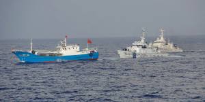 A suspected illegal Chinese fishing boat being monitored by the Japan Coast Guard.