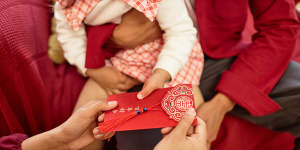 “Hong bao” or red packets are given by adults to children as a Lunar New Year tradition.