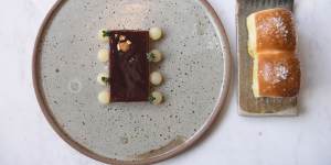 Duck liver parfait with pickled pear and Parker rolls.