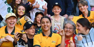 Sam Kerr poses with Matildas fans at a friendly against Canada in September 2022.