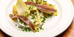 Artichoke entree with buffalo mozzarella,endive and anchovies.