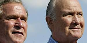 US President George W. Bush (L) stands with retired General Norman Schwarzkopf (R) during a campaign rally at Legend Field 31 October 2004 in Tampa,Florida. Bush and Democratic challenger John Kerry scrambled for votes in the key states of Florida and Ohio,keeping a bruising pace on the campaign trail in a race still too close to call with less than 48 hours until election day. Two tracking polls by The Washington Post and Fox television showed the candidates have evenly split the electorate,with little apparent change since the emergence of a video by al-Qaeda leader Osama bin Laden. AFP PHOTO/Stephen JAFFE