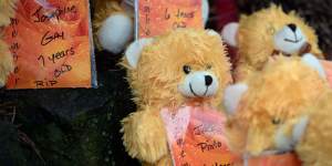 Teddy bears show the names of some of the victims of an elementary school shooting,including Jack Pinto.