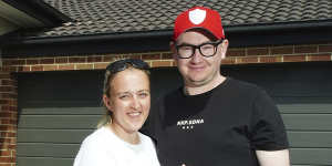  Shannan Fry and her partner Robert Goudge in front of their new home in Melton.
