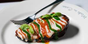 Eggplant parmigiana striped with Napoli sauce,cheese and basil.