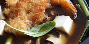 Udon noodle soup with crumbed prawn cutlets.