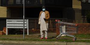 A man wearing a mask in Fairfield earlier this month. The local government area is one of eight where masks will be mandatory outside from tomorrow.
