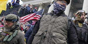 Members of the Oath Keepers extremist group stand on the east front of the US Capitol on January 6,2021.