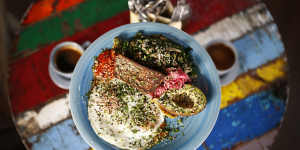 The breakfast plate at Ora includes ghee-fried eggs and gluten-free seed and nut bread.