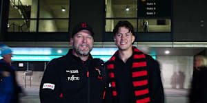 Essendon fan Christopher Klose with his son Jordan outside the MCG.