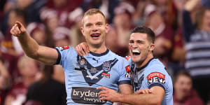 Tom Trbojevic and Nathan Cleary celebrate a try in Origin I. They have surpassed James Tedesco as the best players in the game.