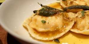 Ravioli with pumpkin,buffalo ricotta,burnt sage butter,and walnut aillade at Two Chaps Nights.