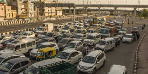 Vehicles driving on a road,after the country relaxed its lockdown restriction in Delhi,India. 