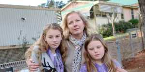 Gas fears . . . Katrina Walters with daughters Georgia and Olivia,who she has taken out of her Berrima School.