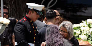 Two women comfort each other during the burial service for Irma Garcia and her husband Joe Garcia. Irma Garcia was killed in last week’s elementary school shooting. Joe Garcia died two days later.