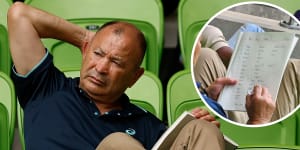Eddie Jones with his notebook at AAMI Park on Sunday and,inset,the draft Wallabies camp list.