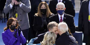 Joe Biden hugs first lady Jill Biden,son Hunter and daughter Ashley after his swearing-in as Kamala Harris looks on. 