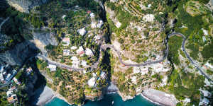 Colourful Positano rises from the sea.