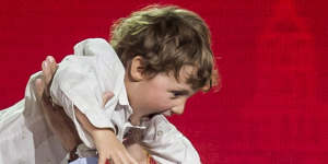 Prime Minister Justin Trudeau lifts his son Hadrien into the air following his speech in Halifax in 2018. 