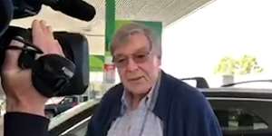 At a servo on the road to Sydney,Pell says he's'very pleased'to be free