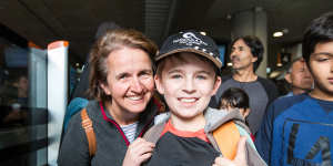 Sonya Gates and son Ryan,who queued for several hours to ride the metro trains on Sunday. 