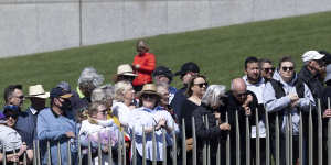 Members of the public watching the proclamation ceremony for King Charles III,at Parliament House in Canberra.