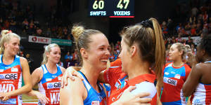 Injured captain Maddy Proud celebrates with the victorious Swifts.