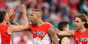 Lance Franklin celebrates kicking a goal against Collingwood.