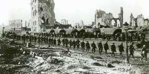 Australian troops on the way to take up a front-line position in the ruins of Ypres. 