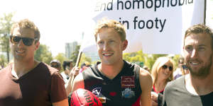 Jason Ball takes part in a pride march in 2013.