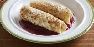 Blintz with cheesecake filling and plum sauce.