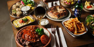 Spread with doner served iskender style with bread,falafel and dips.
