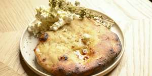 Pita,cooked in Tzaki’s wood oven,is served with feta butter.